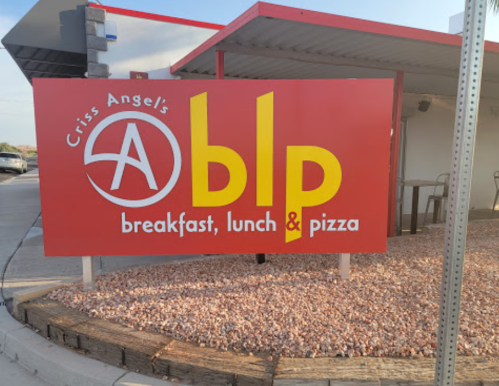 Sign for Criss Angel's ABLP, featuring "breakfast, lunch & pizza" in bold letters on a red background.