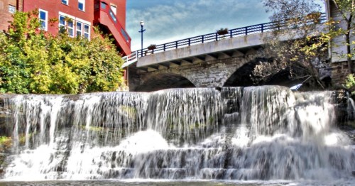 The main waterfall and historic red brick building in downtown Chagrin Falls, Ohio.
