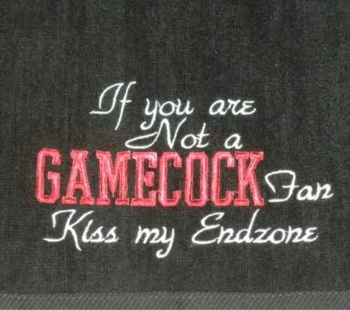 Text on a towel reads: "If you are Not a GAMECOCK Fan Kiss my Endzone" in bold red and white lettering.