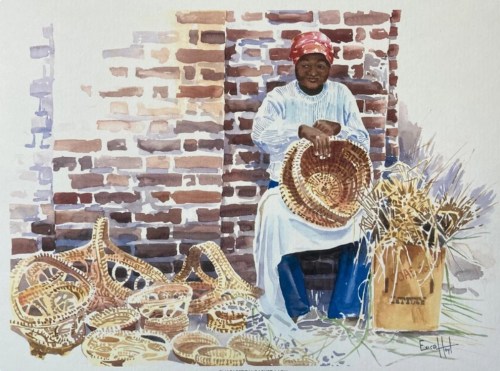 A woman in a red headscarf weaves baskets, surrounded by finished baskets and straw, against a brick wall.