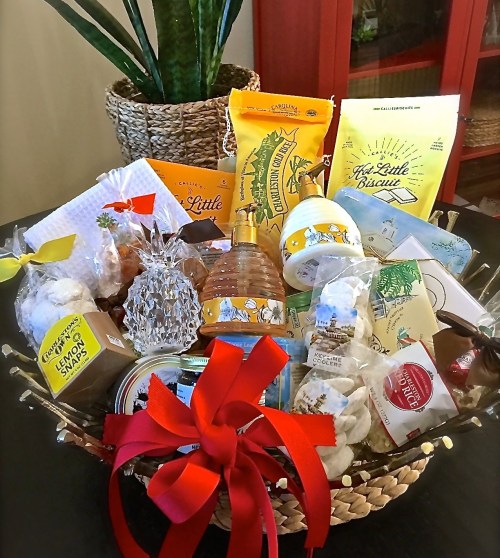 A decorative basket filled with assorted snacks, cookies, and treats, tied with a red ribbon.