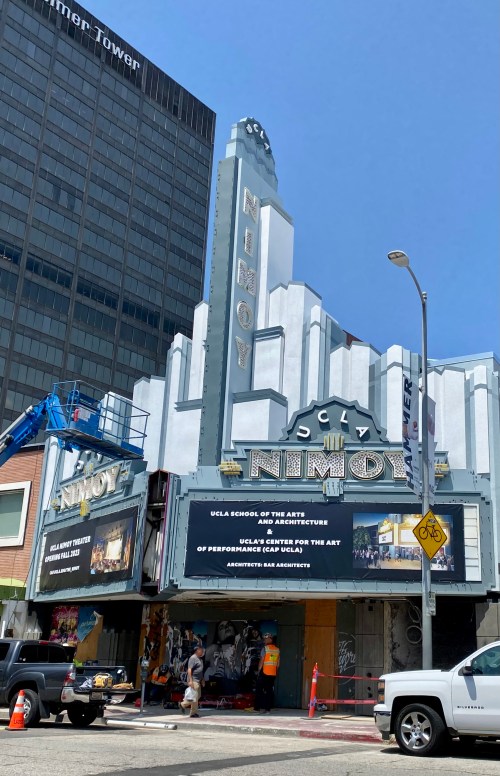 The historic Nimoy Theater building with a marquee displaying UCLA School of the Arts and Architecture events.