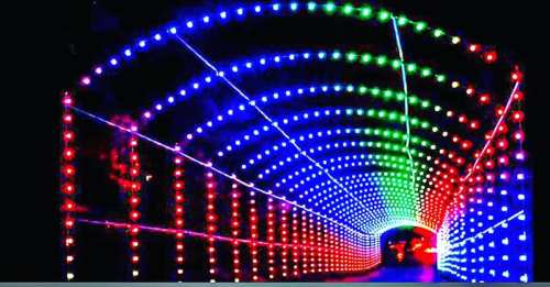 A colorful illuminated tunnel with red, blue, and green lights creating a vibrant, glowing effect.