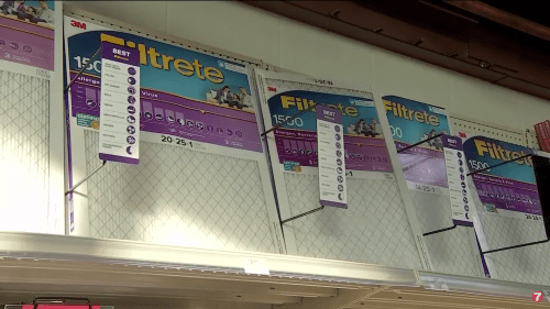 Air filters displayed on a store shelf, featuring various sizes and specifications.