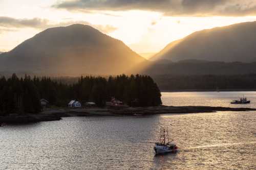 A serene landscape featuring a boat on calm waters, surrounded by mountains and trees at sunset.