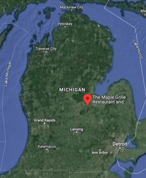 Map of Michigan highlighting the location of The Maple Grille Restaurant with nearby cities and lakes.