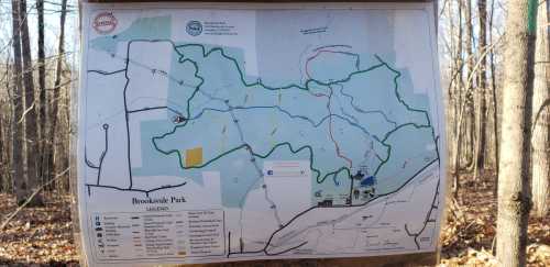 Map of Brooksvale Park showing trails, roads, and park features, surrounded by trees in a wooded area.