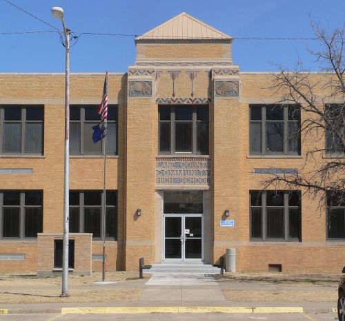 Front view of Lake County Community High School, featuring a brick facade, large windows, and a peaked roof.