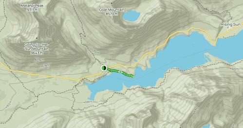 Topographic map showing mountains, a lake, and a road with elevation markers. Key features include Goat Mountain and Rising Sun.