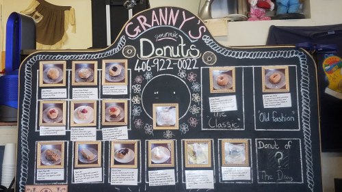 A chalkboard menu displaying various gourmet donuts with photos and descriptions, titled "Granny's Donuts."