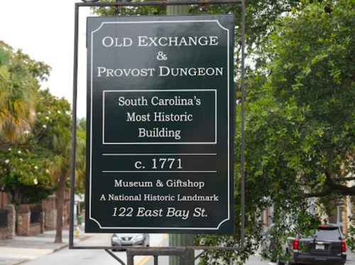 Sign for the Old Exchange and Provost Dungeon, a historic building in South Carolina, established in 1771.