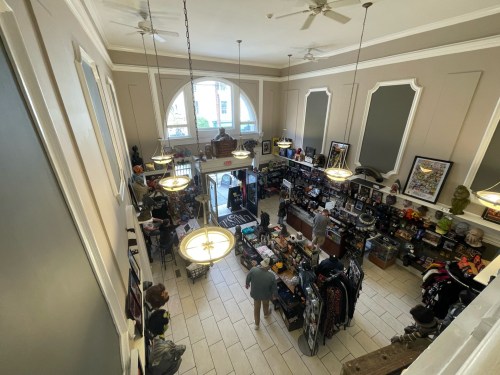 Aerial view of a busy store filled with various merchandise, featuring shelves and displays, and customers browsing.
