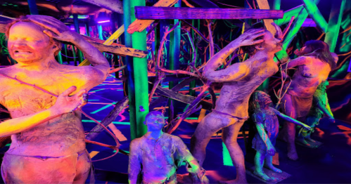 A vibrant, surreal scene featuring abstract human figures surrounded by colorful, twisted structures in a dark space.