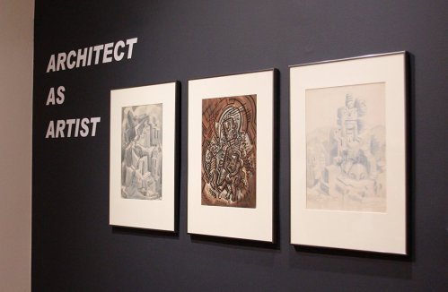 Three framed artworks displayed on a wall with the text "ARCHITECT AS ARTIST" above them.