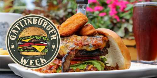 A delicious burger topped with crispy items, surrounded by vibrant flowers and a drink, with a "Gatlinburger Week" logo.