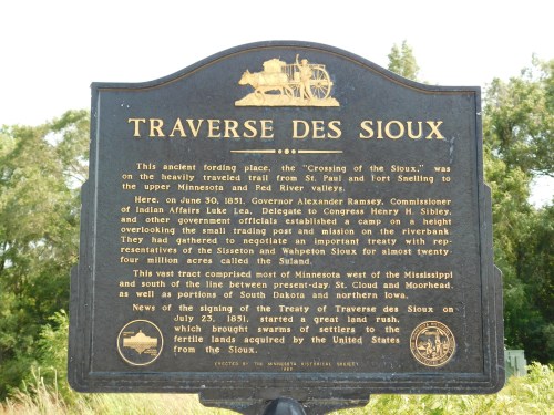 Historical marker about the Traverse des Sioux treaty, detailing its significance and location near the Minnesota River.