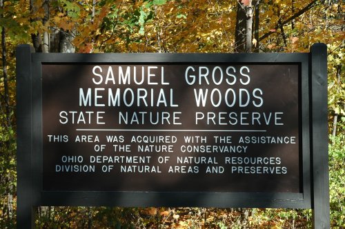 Sign for Samuel Gross Memorial Woods State Nature Preserve, detailing its acquisition and management by conservation organizations.