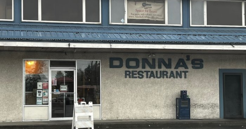 Exterior of Donna's Restaurant, featuring a blue awning and a "Space for Lease" sign above the entrance.