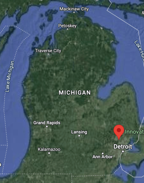 Map of Michigan highlighting Detroit and nearby cities, with water bodies surrounding the state.