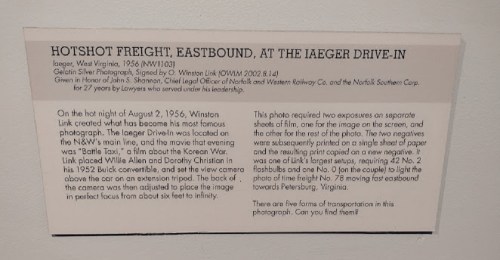 Image of a plaque detailing the history of the Iaegeer Drive-In and a photograph of "Battle Taxi" from 1956.