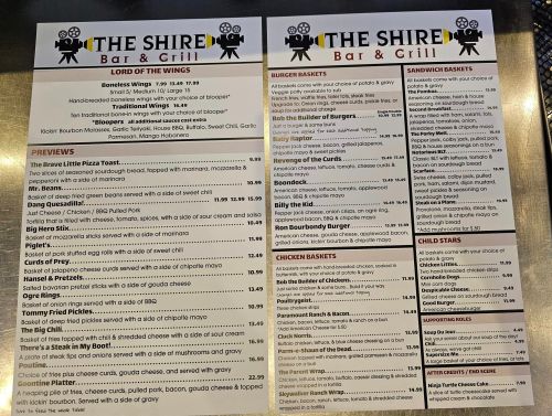 Menu from The Shire Bar & Grill featuring appetizers, burgers, sandwiches, chicken baskets, and child-friendly options.