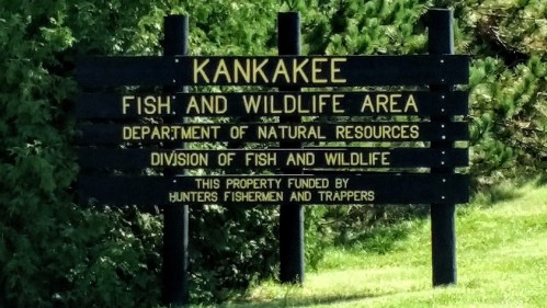 Sign for Kankakee Fish and Wildlife Area, detailing funding by hunters, fishermen, and trappers.