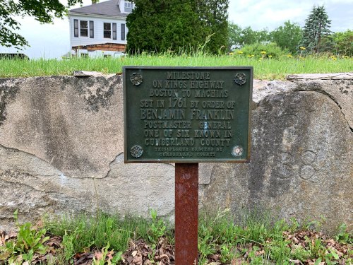 Milestone marker on Kings Highway, noting its historical significance and connection to Benjamin Franklin in 1761.