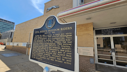Historical marker for the Civil Rights Freedom Riders, detailing their journey and purpose in 1961.
