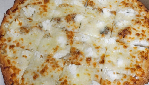 A freshly baked cheese pizza with a golden crust and melted cheese, cut into square slices.