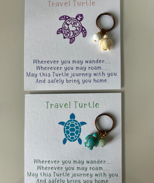 Two cards with turtle charms, featuring a travel blessing: "May this Turtle journey with you. And safely bring you home."
