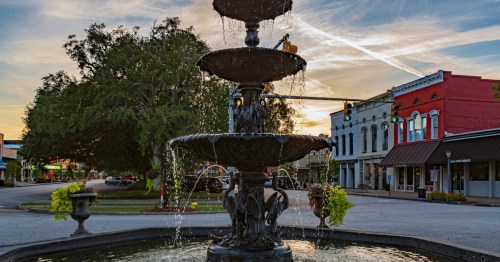 A fountain in downtown Eufaula, Alabama at dusk.