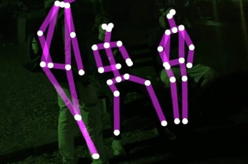Three figures outlined with purple lines and white dots, set against a dark background, suggesting a night scene.