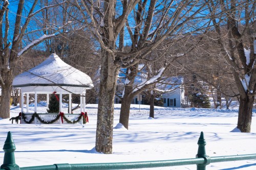 Gazebo with Christmas decorations surrounded by snow