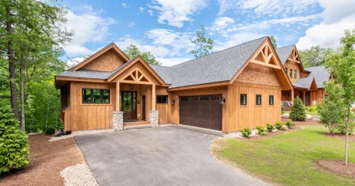 exterior of a modern, newly built, luxury cabin in lincoln new hampshire