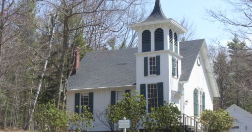 exterior of a charming green and white church in the remote town of mount washington ma