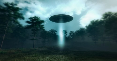 A UFO hovers above a forest, emitting a beam of light through misty trees under a cloudy sky.