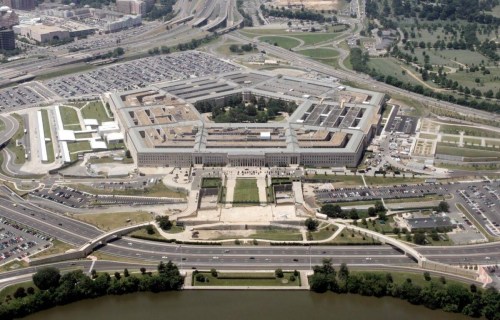 Aerial view of the Pentagon, surrounded by roads, parking lots, and green spaces.