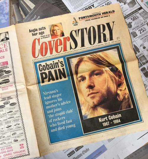A newspaper cover featuring Kurt Cobain with the headline "Cobain's Pain" and a photo of him, dated August 22, 1994.
