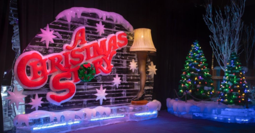 Ice sculpture featuring "A Christmas Story" title, a leg lamp, and decorated Christmas trees with lights.