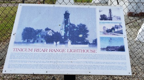 Sign about the Tinicum Rear Range Lighthouse, featuring historical photos and information about its construction and significance.