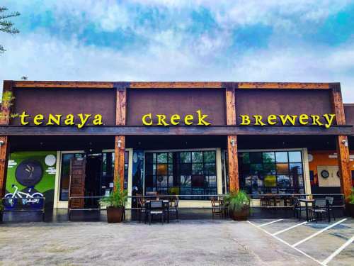 Exterior of Tenaya Creek Brewery featuring a colorful facade and outdoor seating area.