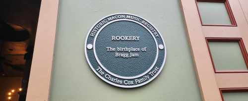 Plaque on a wall reading "Rookery: The birthplace of Bragg Jam" with a historic music registry logo.
