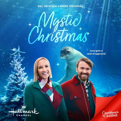 A festive scene featuring a man and woman in winter attire, with a seal swimming in a snowy underwater setting.