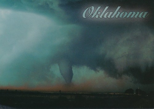 A dramatic tornado touches down in a stormy Oklahoma landscape, with dark clouds swirling above.