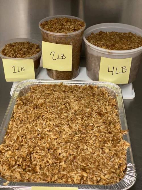 Containers of cooked rice in various sizes labeled 1 lb, 2 lb, and 4 lb, arranged on a white surface.