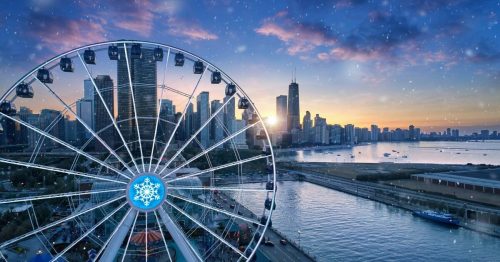 A ferris wheel overlooks a city skyline at sunset, with snowflakes gently falling in the foreground.