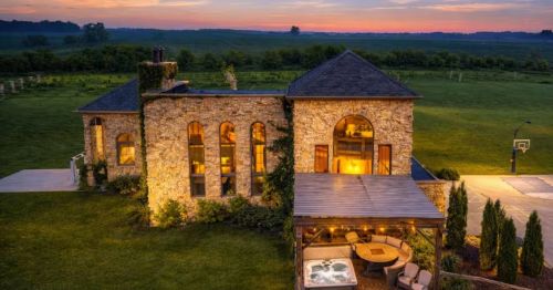 Sunset view of a mansion on a vineyard in Cleveland, Wisconsin