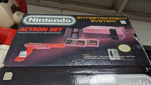 Nintendo Entertainment System Action Set box featuring a console, two controllers, and a Zapper light gun.