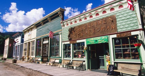 Historic downtown Lake City CO. View of 19th-century storefronts like the Packer Saloon, reflecting a charming remote town.