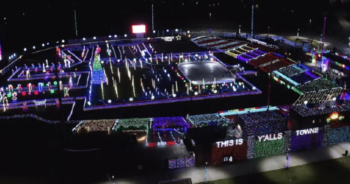 Aerial view of a festive holiday light display featuring colorful decorations and an ice skating rink.